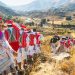 Vibrant Andean festival in Cayma, Peru with locals in traditional costumes celebrating cultural heritage.